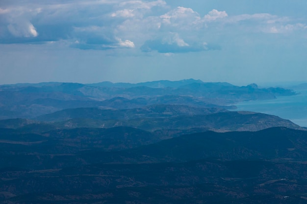 Mountain landscape forested mountains and blue sea Top view