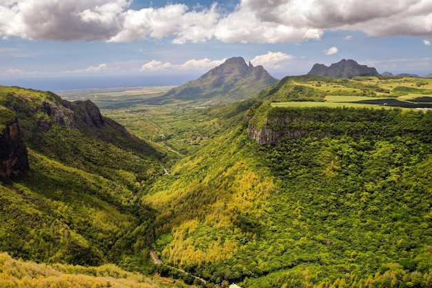 Mountain Landscape of the gorge on the island of Mauritius, Green mountains of the jungle of Mauritius.