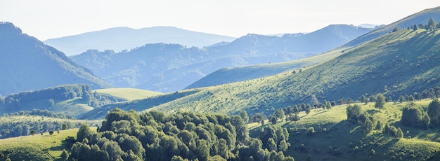 Mountain landscape green mountains and hazy hills panoramic