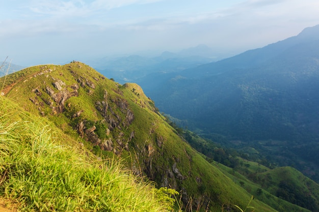 Mountain landscape, green slopes. Beauty of mountains. Little Adam peak, mountain in the fog view from the jungle