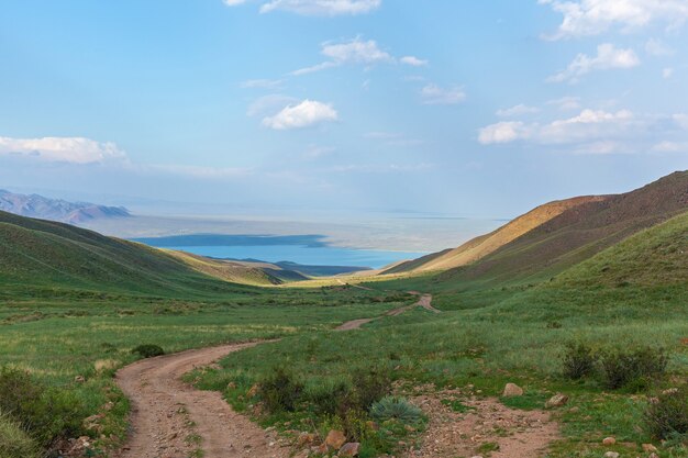 The mountain landscape of plateau of Assy is Kazakhstan, mountain dirt road to the lake