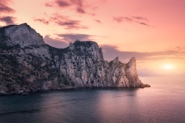 Mountain landscape on the sea at sunset