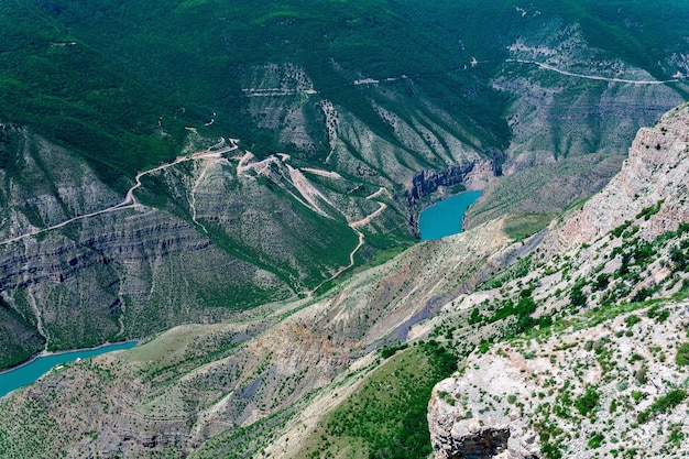 Mountain landscape view of the deep canyon with blue water valley of the Sulak river in Dagestan