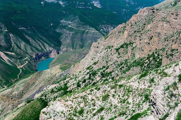 Mountain landscape view of the deep canyon with blue water valley of the Sulak river in Dagestan