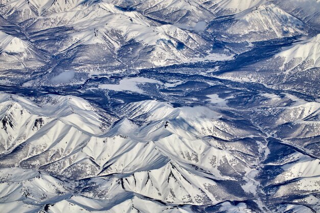 Mountain landscape view from an airplane Snowy panorama