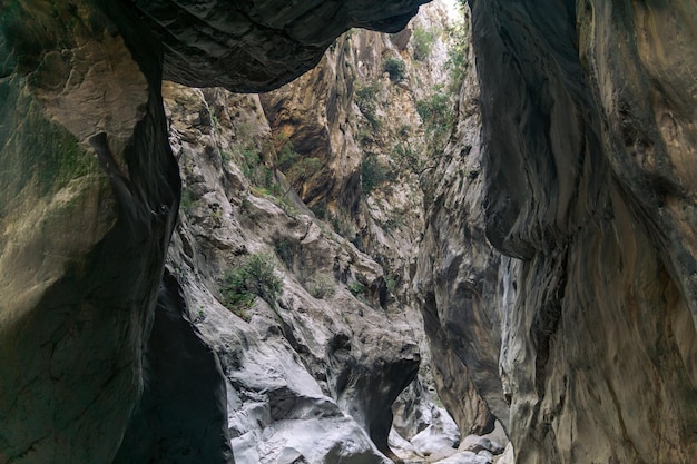 Mountain landscape view from the bottom of a deep canyon