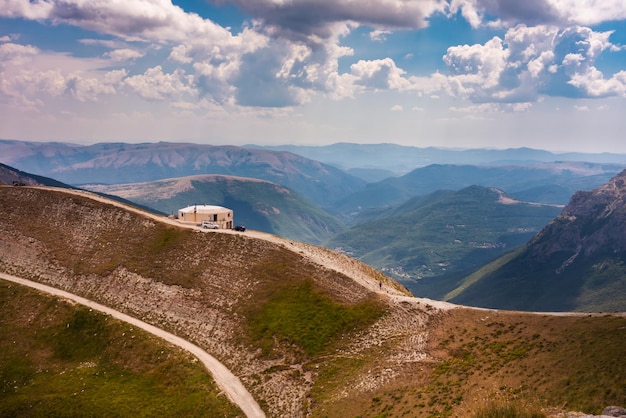 Mountain landscape with a road and a mountain shelter beautiful nature