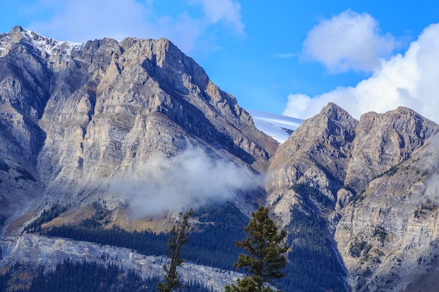 Mountain peaks shrouded in fog and clouds Banff National Park Alberta Canada