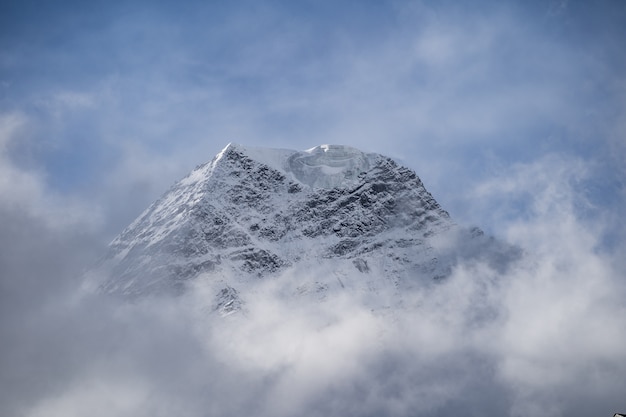 Mountain peeks surrounded in clouds