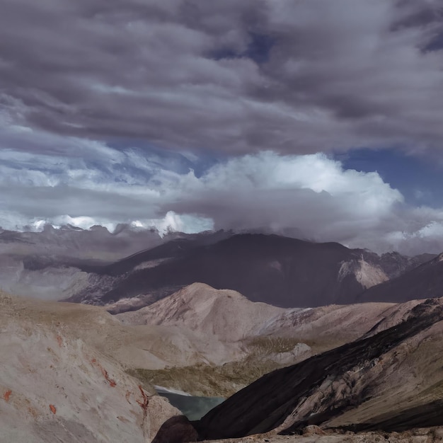 A mountain range is shown with a cloudy sky in the background.