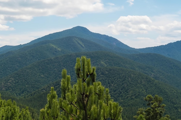 a mountain range with a mountain in the background