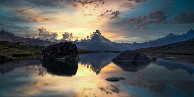 Mountain reflection on lake at sunset