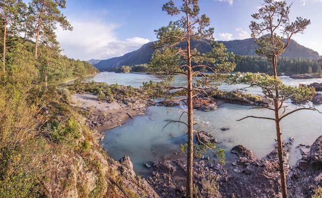 Mountain river in the evening light rocky shore