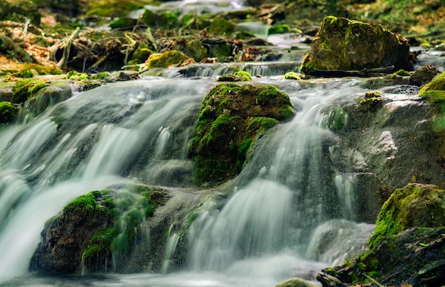 Mountain river with stones with pure thawed water.