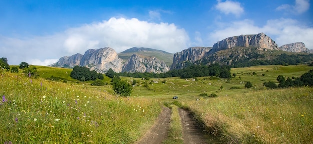 Mountain road in spring ridge landscape