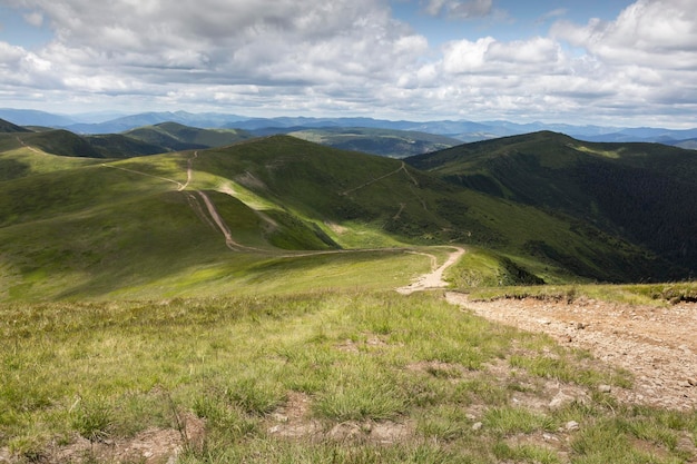 Mountain roads along green peaks in rural Carpathians