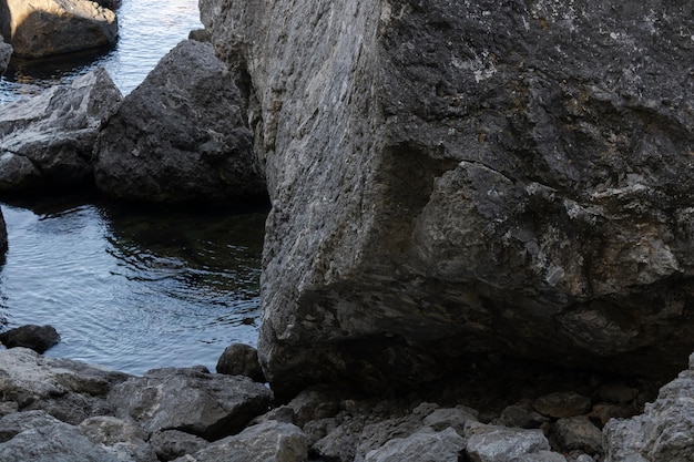 Mountain rock in the sea bay