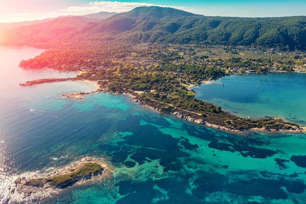 Mountain seascape on a sunny day view from above Rocky beach with beautiful bays Vourvourou Greece