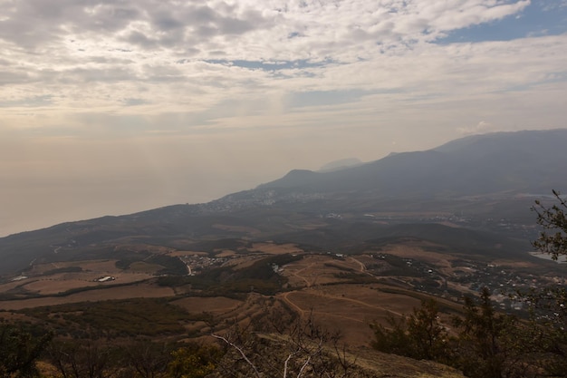 The mountain slope of the Demerdzhi massif View of the valley from the top of the trail