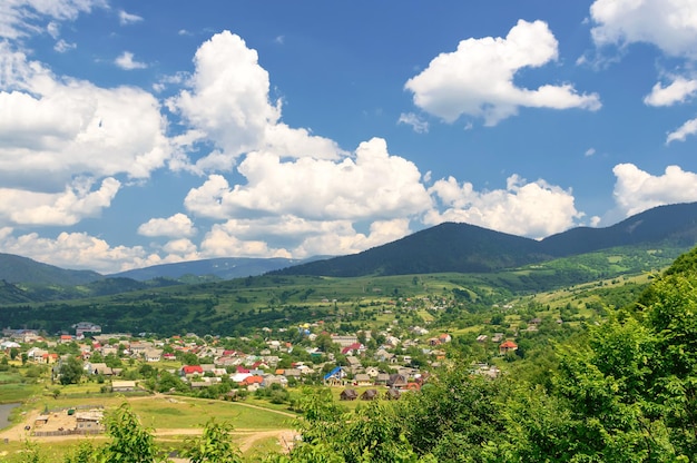 Mountain valley on a background of the rural landscape. Summer season