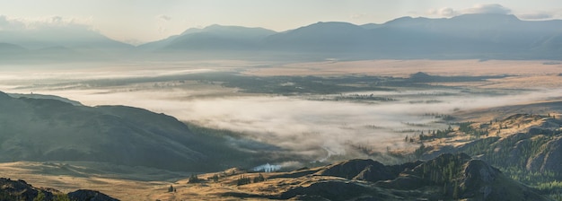 Mountain valley in fog morning