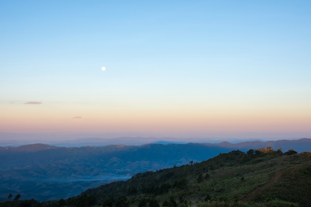 Mountain view with moon in morning.