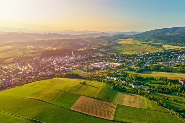 Mountain village and agricultural fields aerial view nature landscape