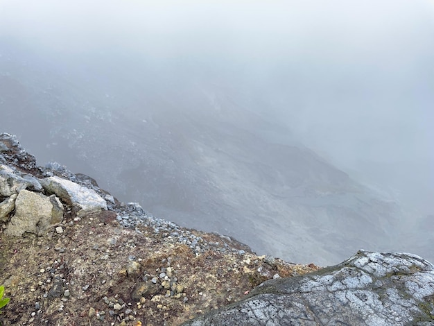 a mountain with a gray rock in the middle