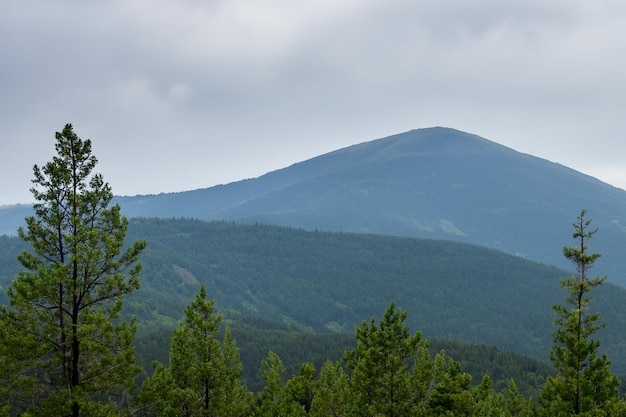 a mountain with a green mountain in the background