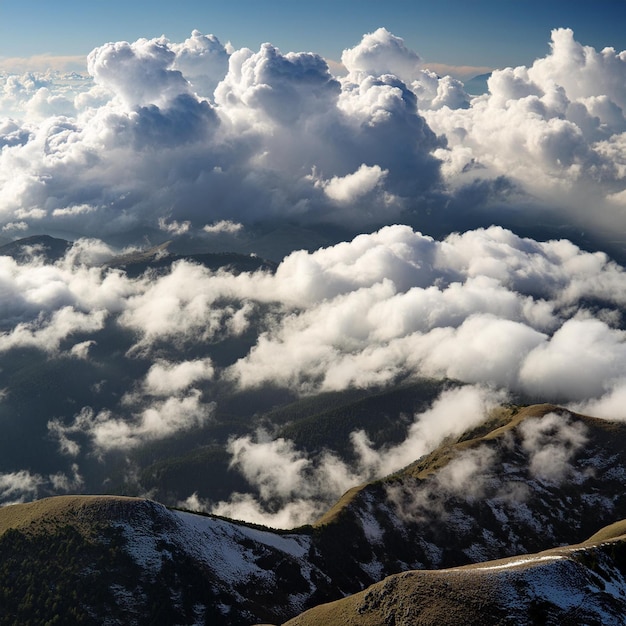 a mountain with a mountain view and clouds in the background