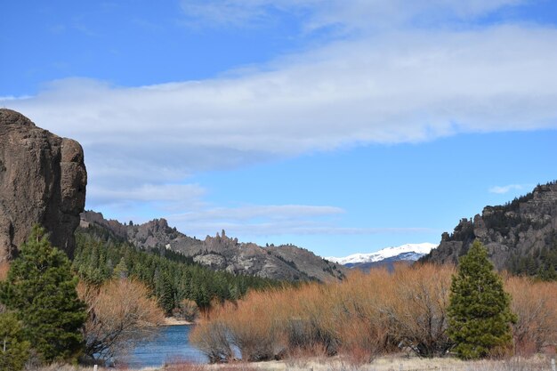 a mountain with a river and a mountain in the background