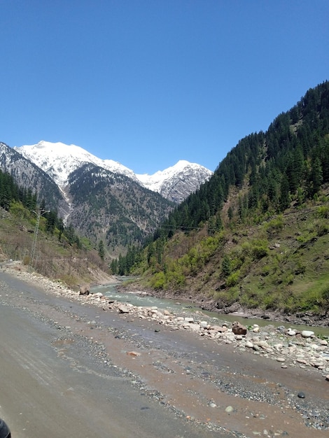 A mountain with a river running through it