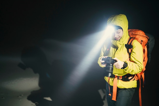 Mountaineer trekking in the cold night at Glen Coe, Scotland