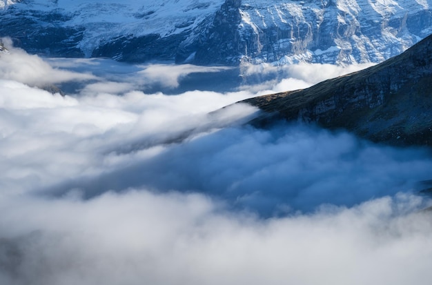 Mountains and clouds in the valley Natural landscape Mountain range through the clouds Landscape in the summertime Large resolution photo