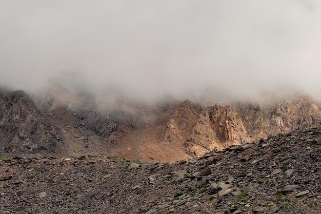 Mountains in a dense fog Mystical landscape with beautiful shar