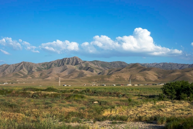 Mountains fields houses power lines