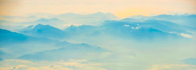 Mountains in fog sunset