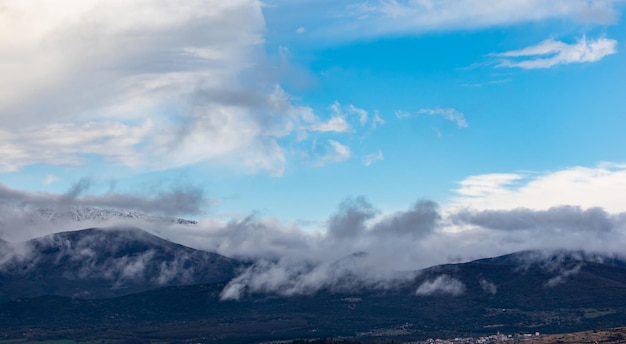 Mountains full of trees and clouds