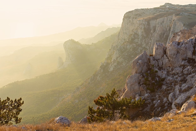 Mountains of golden light. Beautiful golden sunrise or sunset high in the mountains.