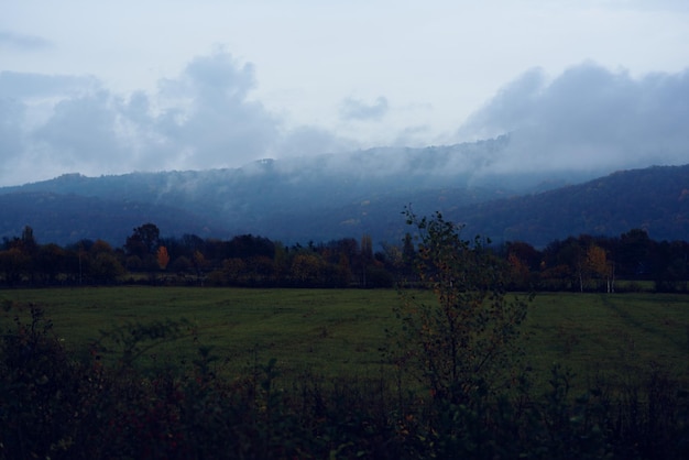 Mountains green grass mountains fog travel nature High quality photo