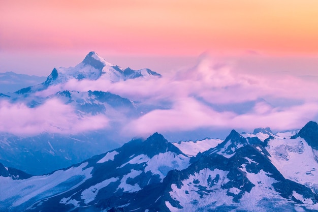 Mountains and moving clouds at sunset