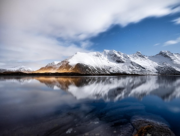 Mountains and night sky Lofoten islands Norway Reflection on the water surface Winter landscape with night sky Long exposure shot Norway travel image