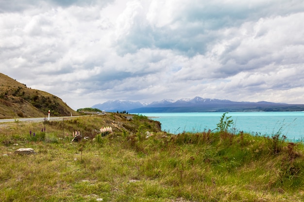 Mountains over turquoise water Trek towards the Southern Alps and Mount Cook New Zealand