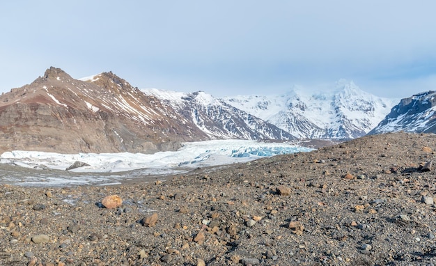 Mountains valleys and volcano around entrance of ice cave very famous landmark in Iceland travel