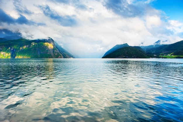 Mountains with clouds on the fjord in Norway. Beautiful norwegian landscapes