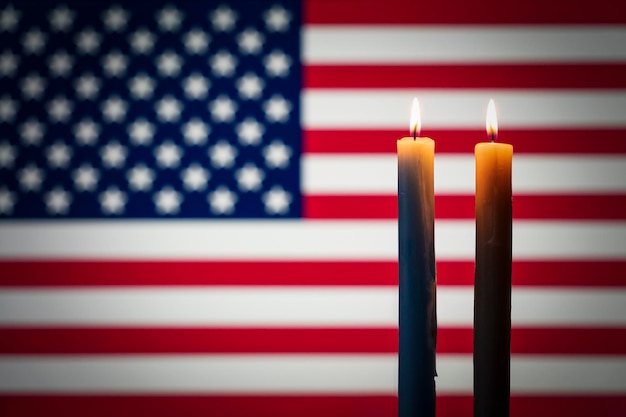 Mourning in the country country united states of america burning candle on the background of the US flag Victims of cataclysm or war concept memorial day remembrance day National mourning