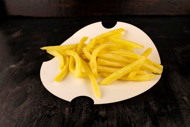 Mouthwatering delicious french fries on a disposable plate