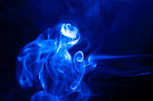 Movement blue smoke on black background.