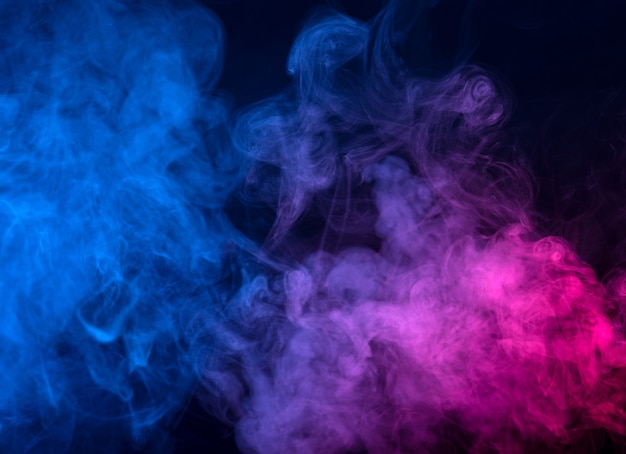 Movement of color smoke isolated on black