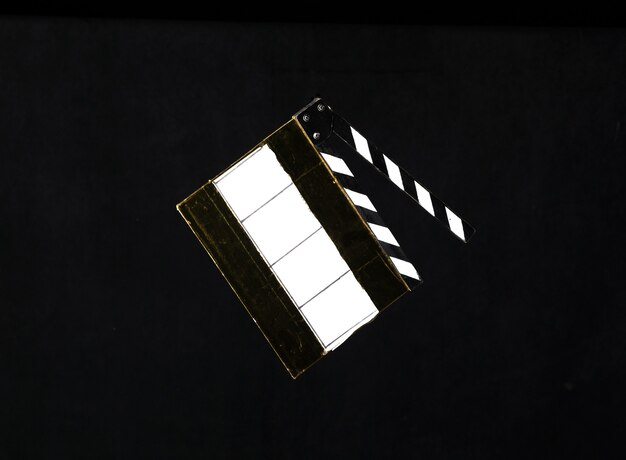 movie clapper on black background